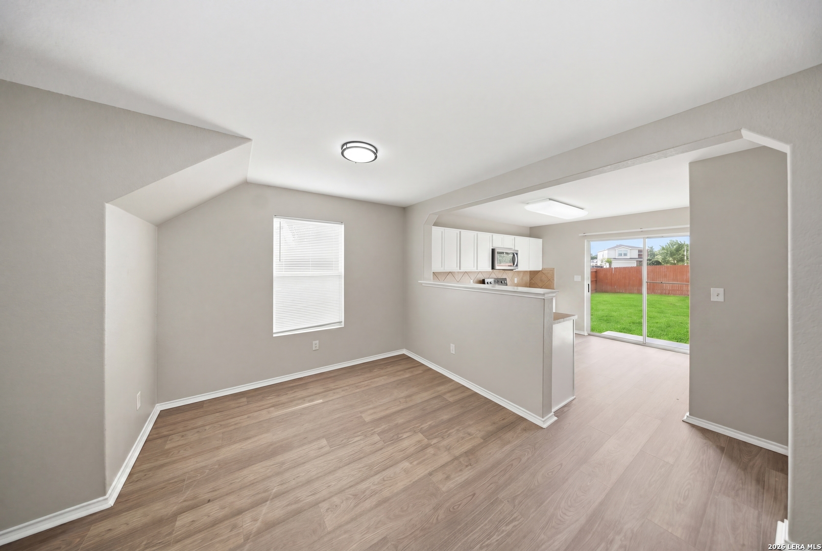 403 Walnut Crest Schertz, TX 78154 - Photo 10 of 30 a view of empty room with wooden floor and fan