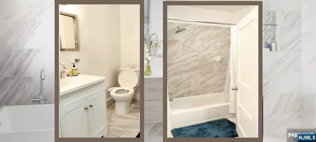 a bathroom with a granite countertop toilet a sink and a bathtub