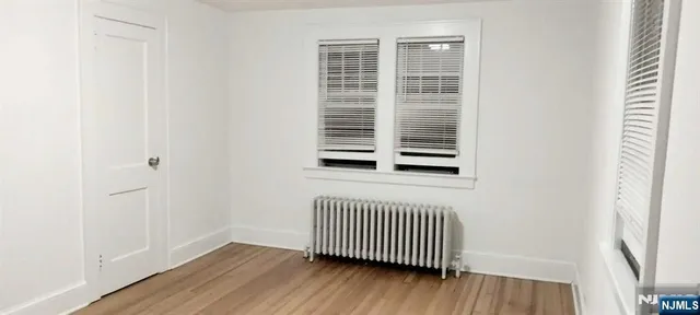 a view of a livingroom with wooden floor
