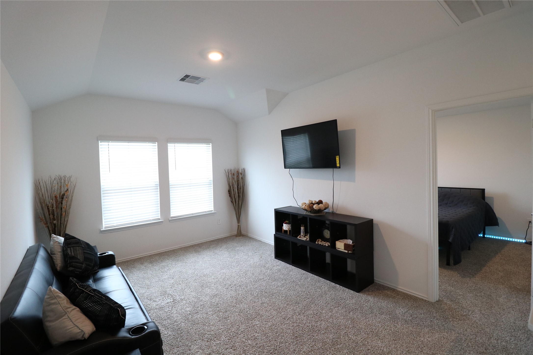 5415 Tuscany Hills Lane Spring, TX 77373 - Photo 11 of 18 a living room with furniture and a flat screen tv