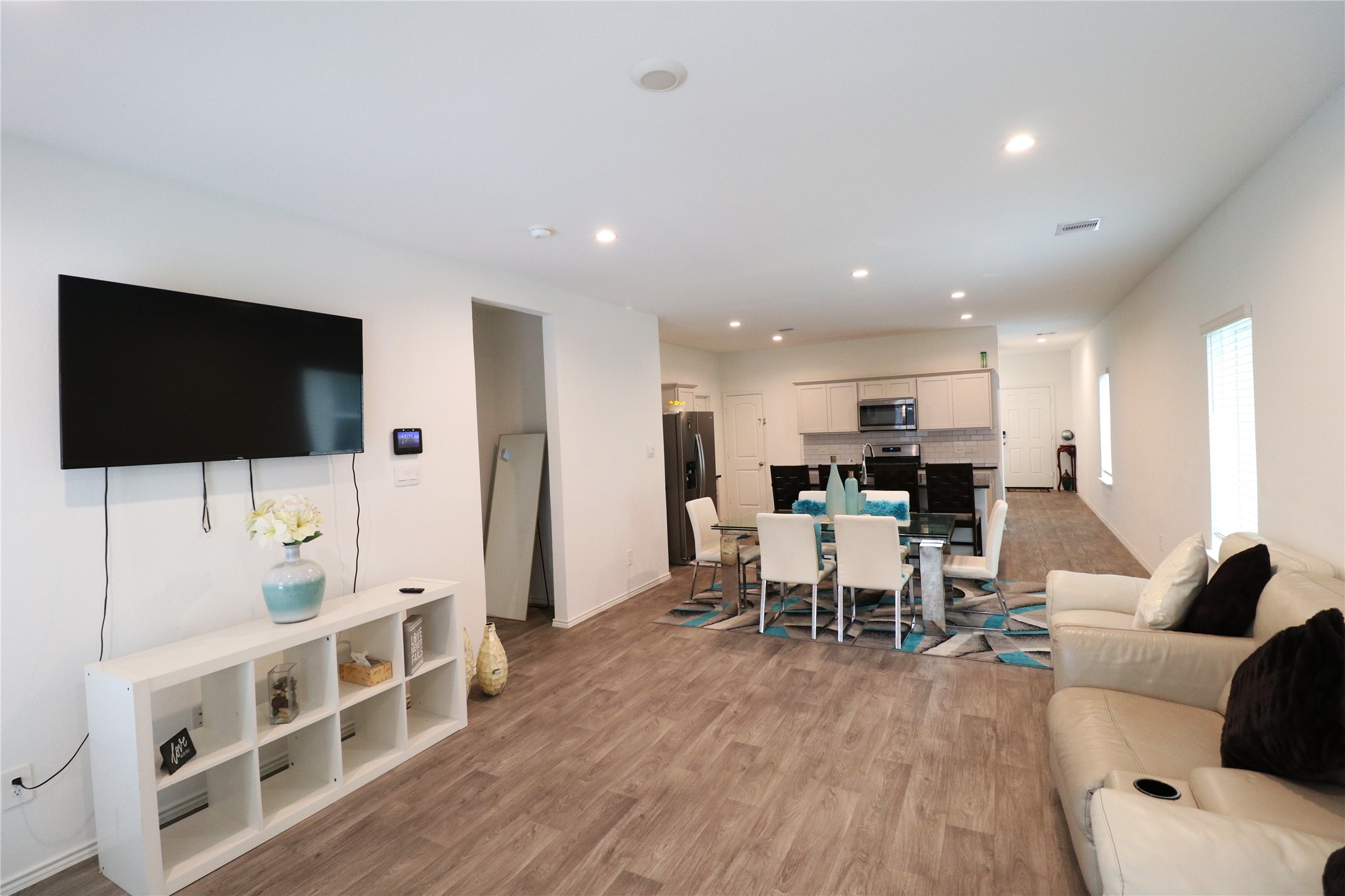 5415 Tuscany Hills Lane Spring, TX 77373 - Photo 7 of 18 a living room with furniture and a flat screen tv
