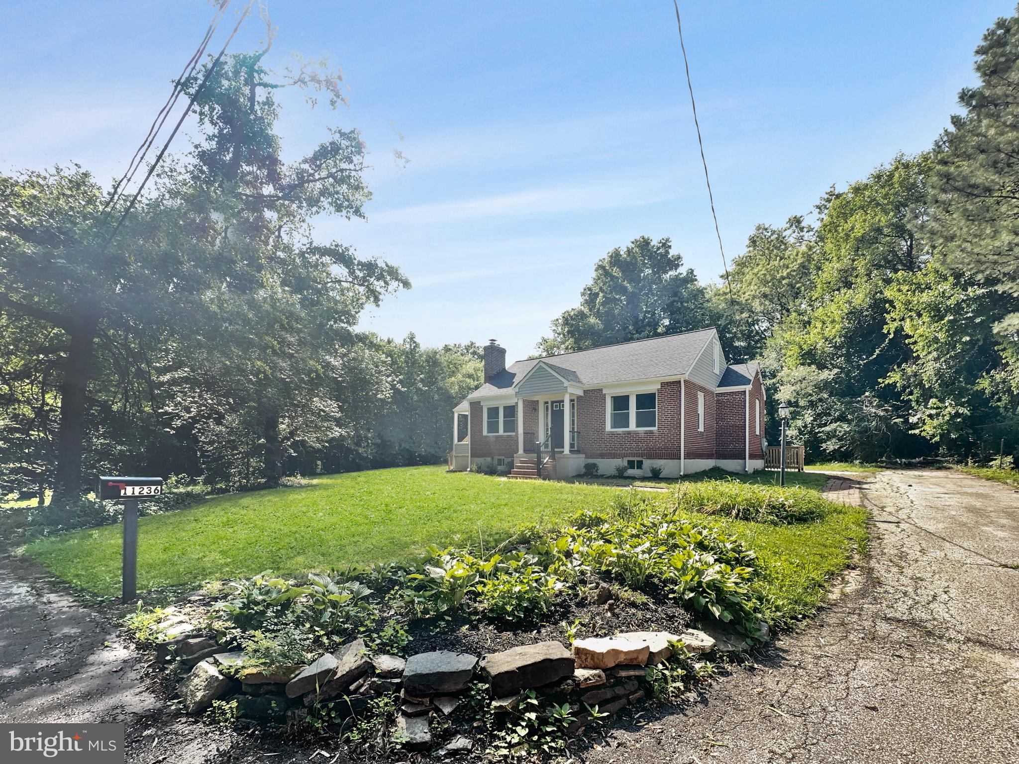 11236 McCubbin Avenue Upper Falls, MD 21156 - Photo 33 of 42 Large yard - mature trees, landscaping & driveway