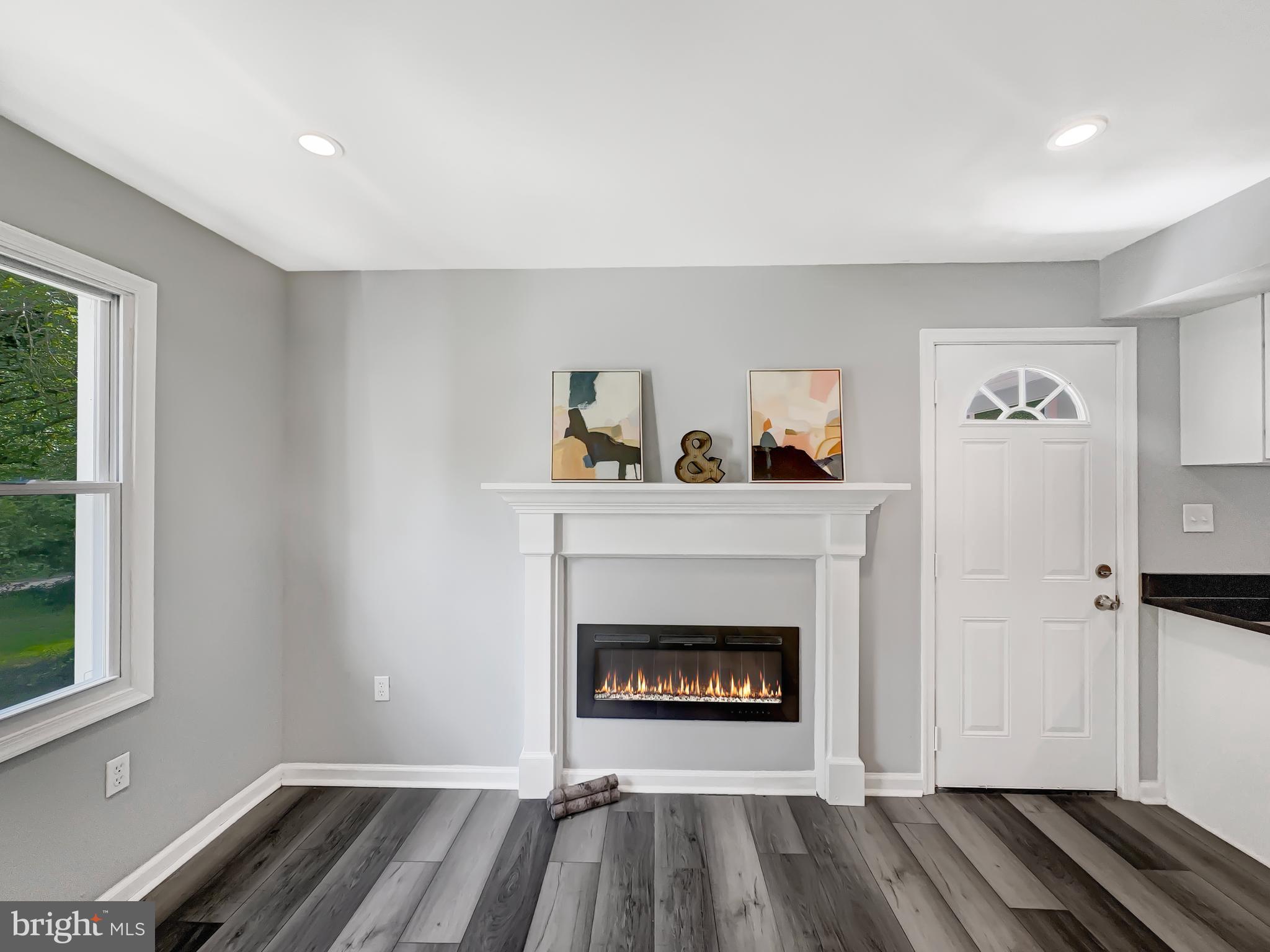 11236 McCubbin Avenue Upper Falls, MD 21156 - Photo 4 of 42 Modern electric fireplace in the living room