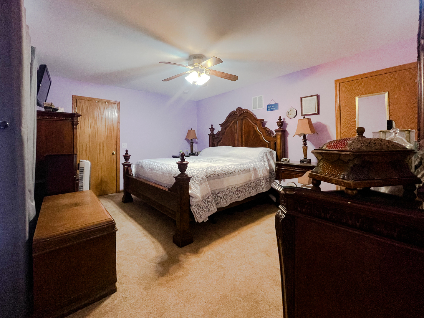 2816 2559th Road Marseilles, IL 61341 - Photo 15 of 22 a bedroom with a bed and a chandelier