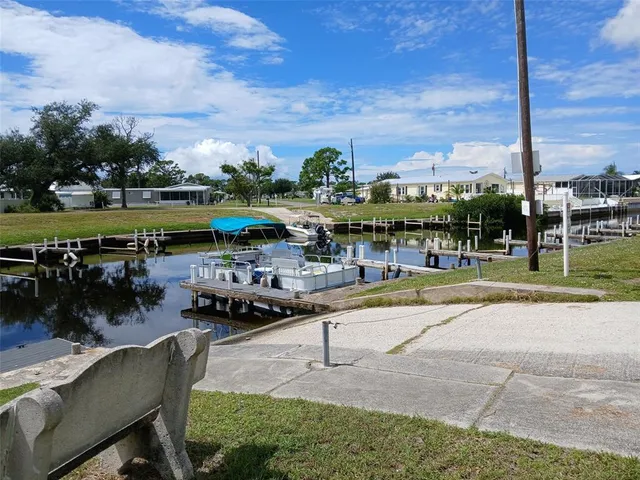 a swimming pool with outdoor seating and yard