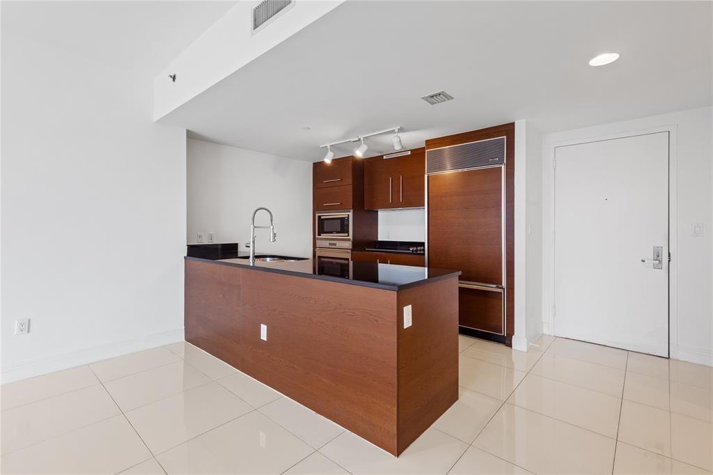 465 Brickell Avenue, Unit 2706 Miami, FL 33131 - Photo 7 of 26 a room with furniture and a window