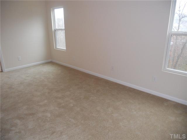 6401 Flanking Lane, Unit 178 Raleigh, NC 27610 - Photo 10 of 18 Spacious Master Bedroom with great view of protected trees!