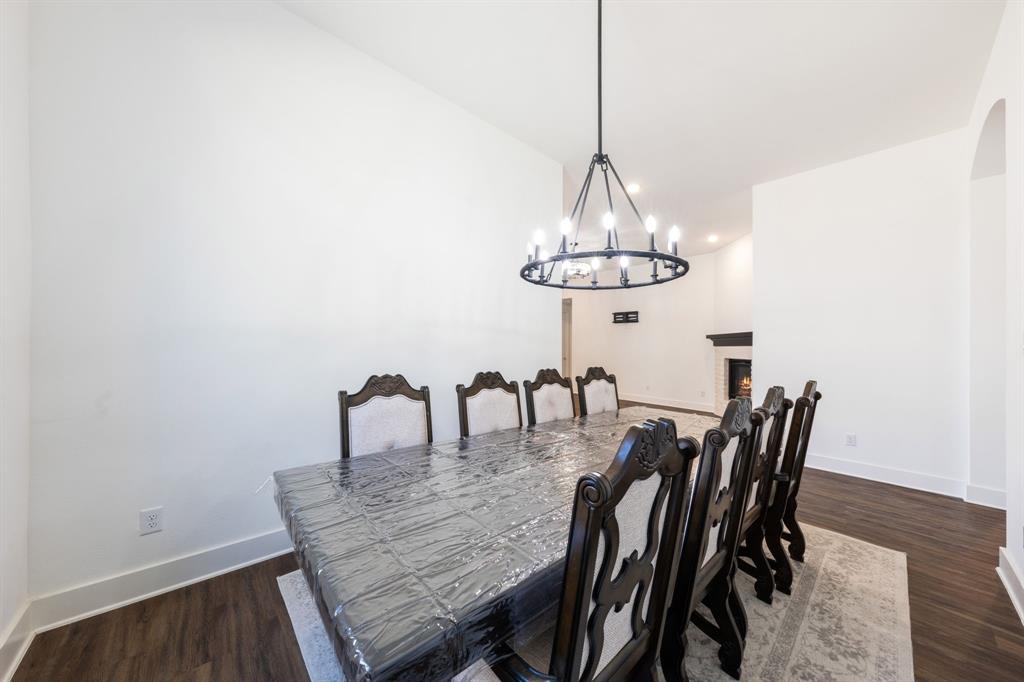 1723 Cypress Gap Trail Mansfield, TX 76063 - Photo 17 of 29 a dining room with furniture and chandelier