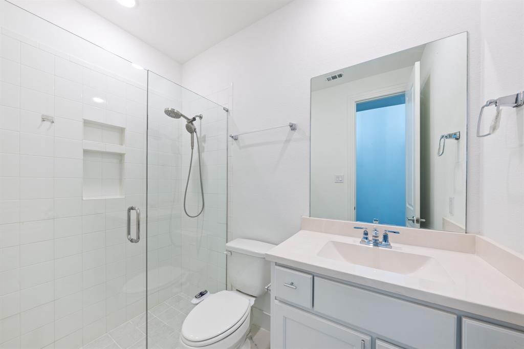 1723 Cypress Gap Trail Mansfield, TX 76063 - Photo 21 of 29 a bathroom with a sink a toilet and shower