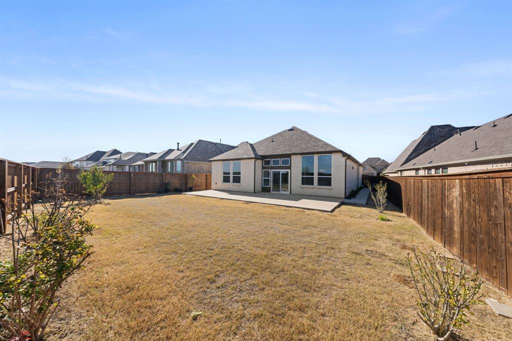 1723 Cypress Gap Trail Mansfield, TX 76063 - Photo 28 of 29 a front view of a house with a yard