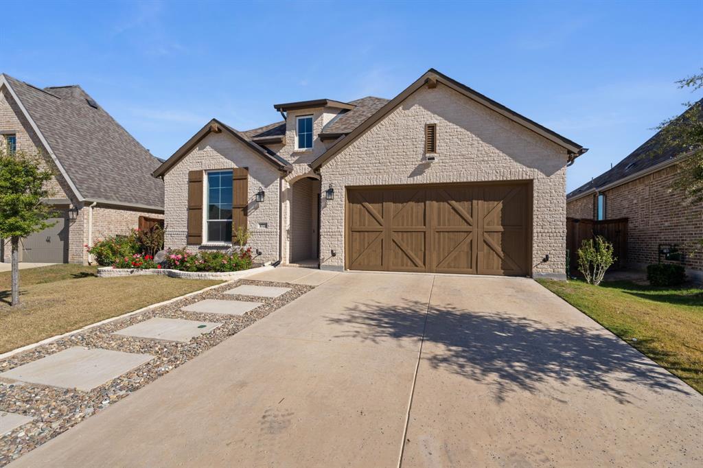 1723 Cypress Gap Trail Mansfield, TX 76063 - Photo 4 of 29 a front view of a house with a yard and garage