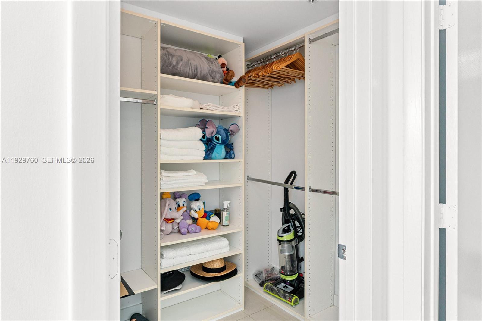 92 Southwest 3rd Street, Unit 4704 Miami, FL 33130 - Photo 16 of 34 a view of walk in closet with clothes and shoes