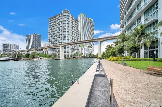 a swimming pool with outdoor seating and yard