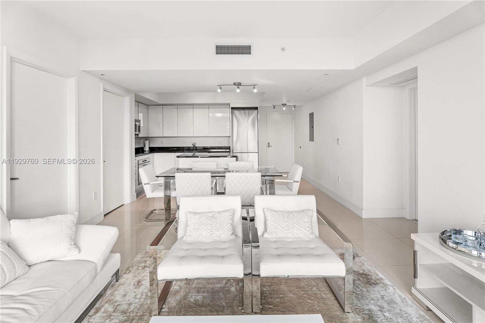 92 Southwest 3rd Street, Unit 4704 Miami, FL 33130 - Photo 5 of 34 a living room with stainless steel appliances furniture and a rug