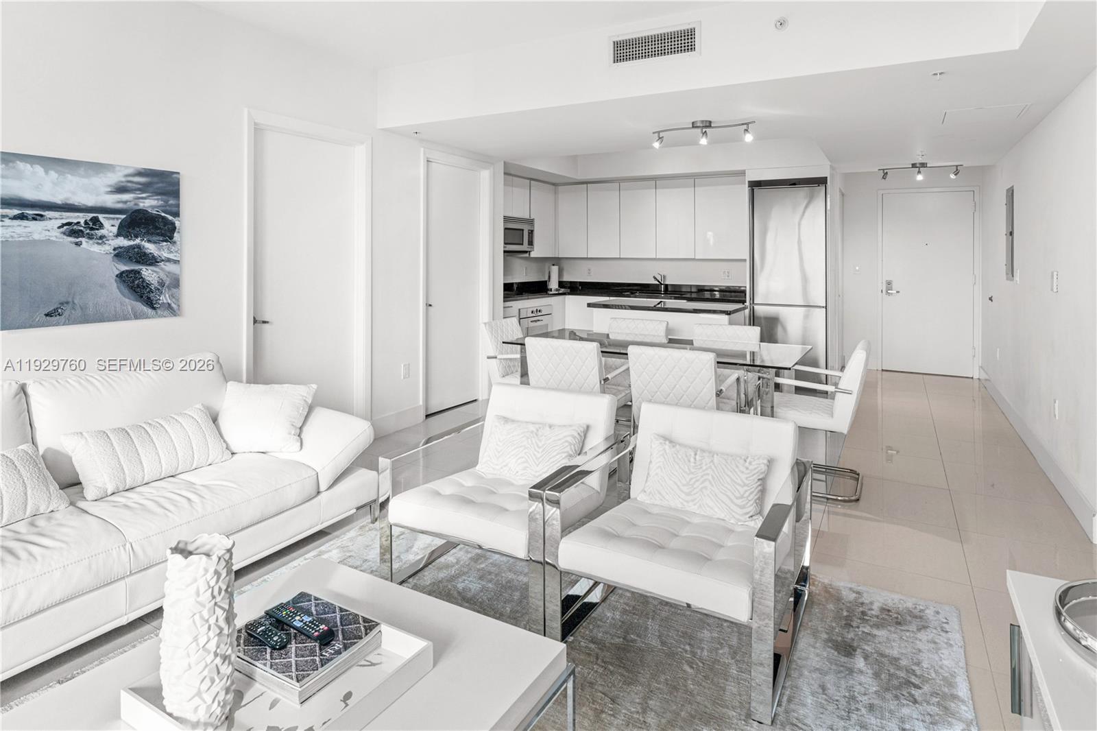 92 Southwest 3rd Street, Unit 4704 Miami, FL 33130 - Photo 6 of 34 a living room with furniture and a view of kitchen