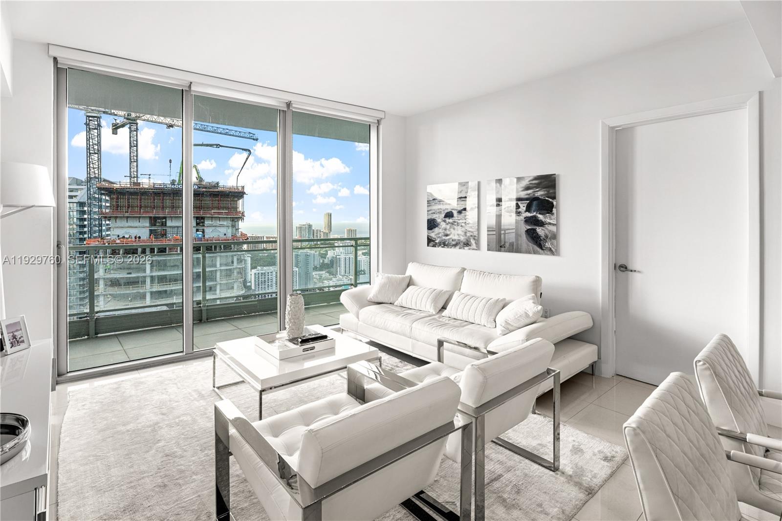 92 Southwest 3rd Street, Unit 4704 Miami, FL 33130 - Photo 7 of 34 a living room with furniture and a large window