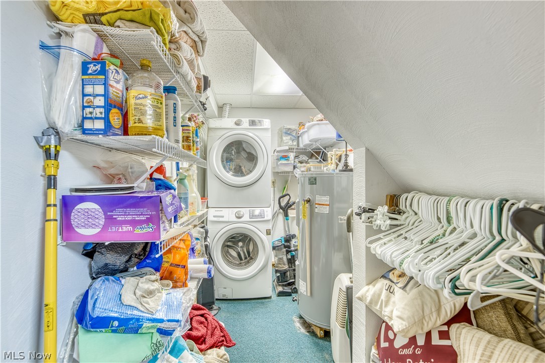 55265 Jim Ball Road Senecaville, OH 43780 - Photo 28 of 44 Clothes washing area with stacked washer / drying machine and electric water heater