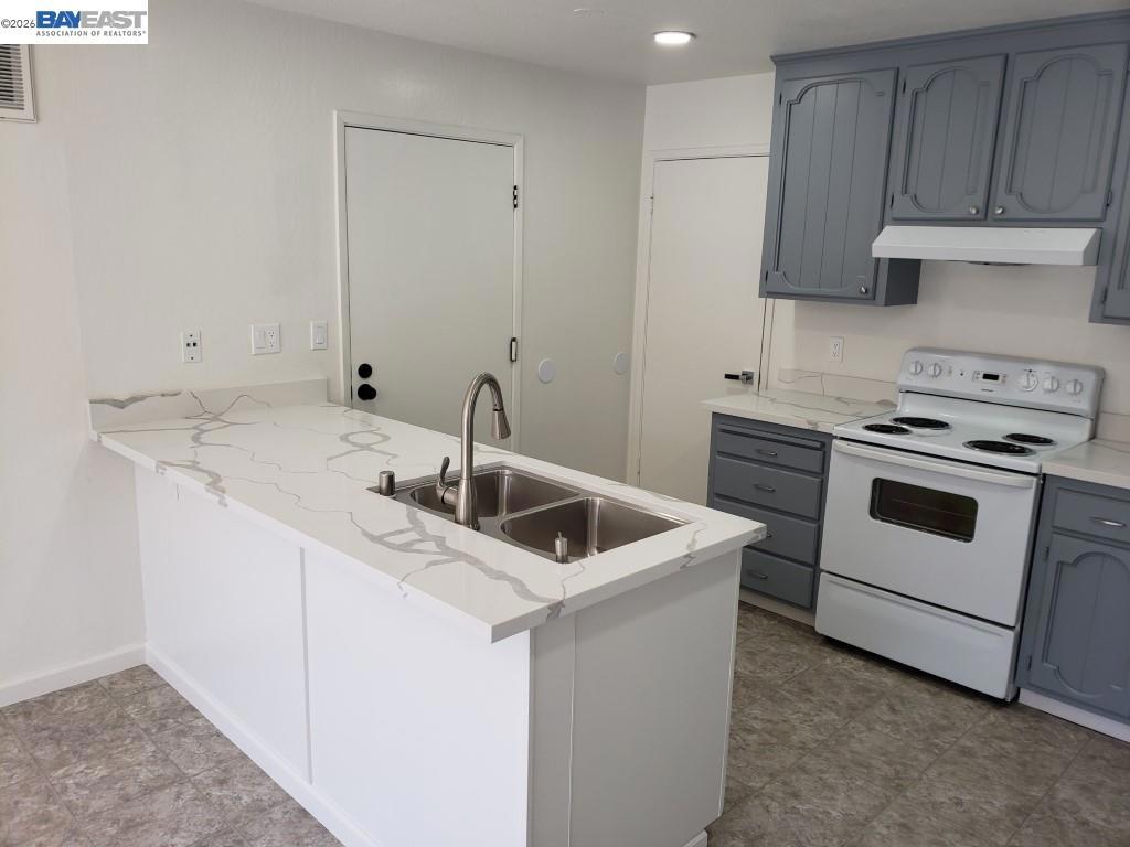 342 Washington Boulevard Fremont, CA 94539 - Photo 4 of 12 a kitchen with white cabinets sink and white appliances