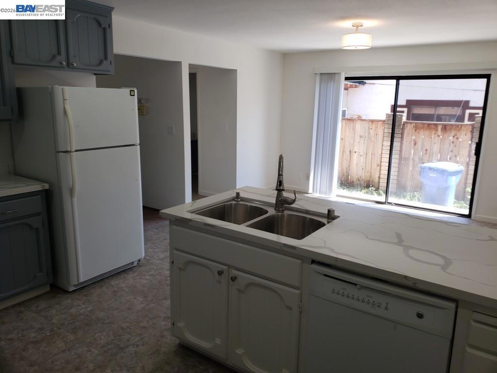 342 Washington Boulevard Fremont, CA 94539 - Photo 8 of 12 a kitchen with a refrigerator and a sink