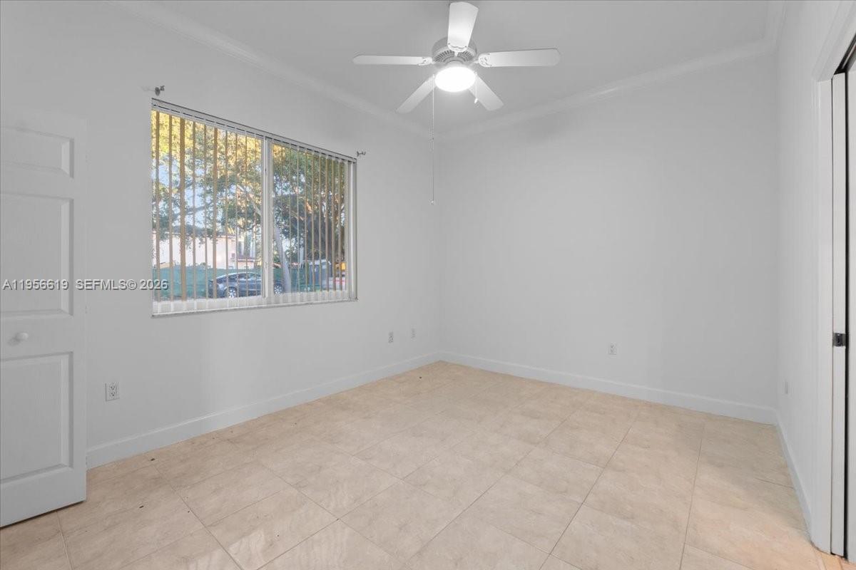 16640 Northwest 86th Court Miami Lakes, FL 33016 - Photo 12 of 23 an empty room with a window