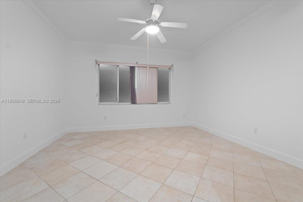 16640 Northwest 86th Court Miami Lakes, FL 33016 - Photo 15 of 23 an empty room with chandelier fan
