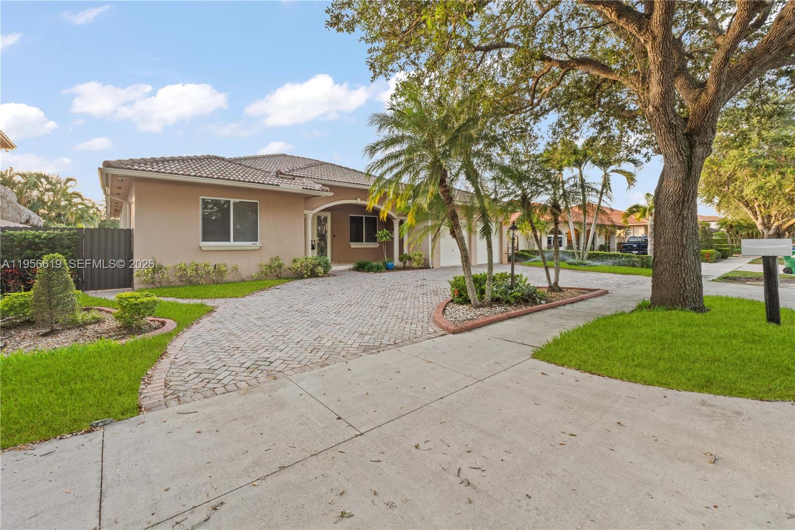 16640 Northwest 86th Court Miami Lakes, FL 33016 - Photo 3 of 23 front view of a house with a yard