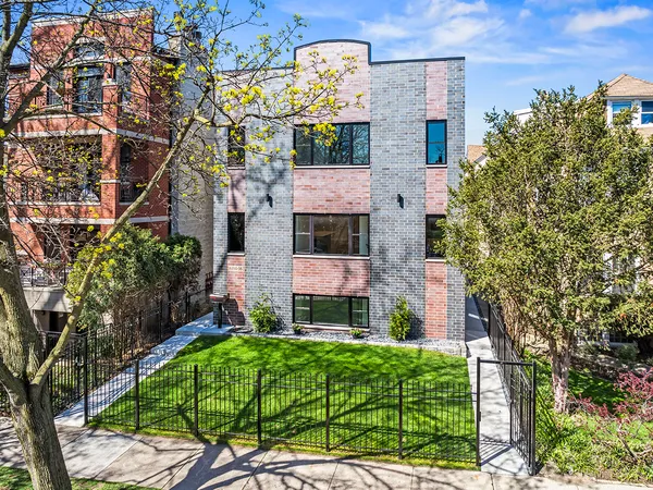 a aerial view of a house with a yard