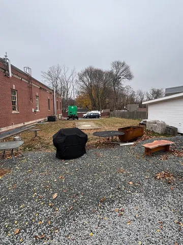 a view of a swimming pool with a yard
