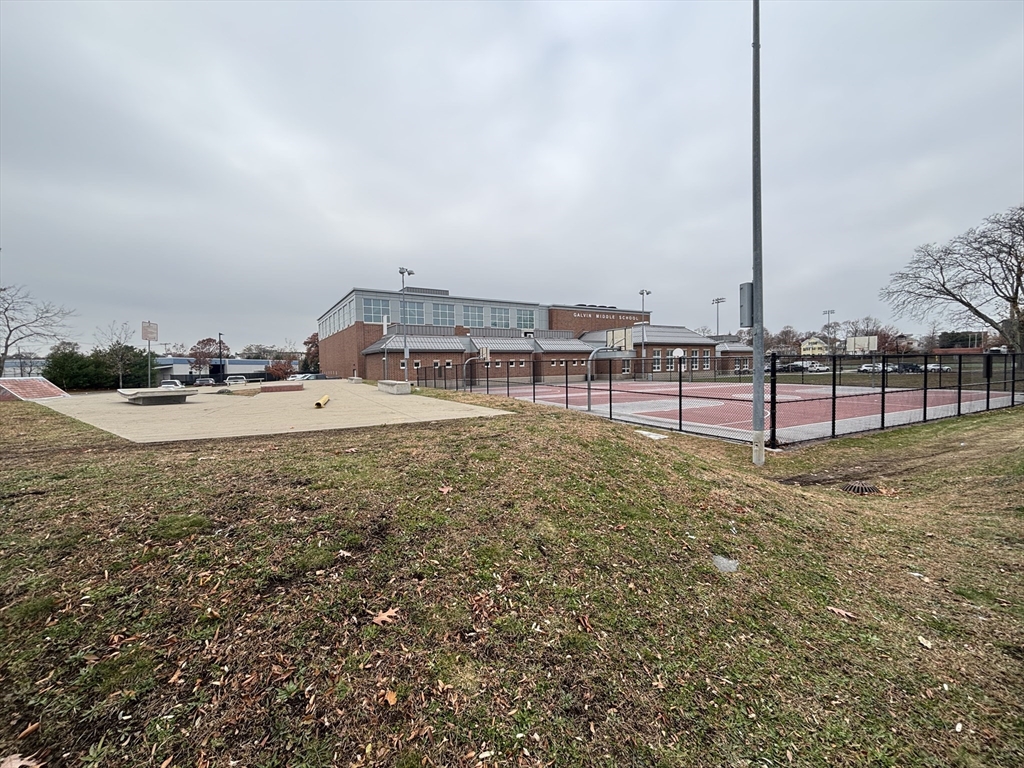 554 Main Street, Unit 2 Wakefield, MA 01880 - Photo 16 of 16 a view of a swimming pool with a yard
