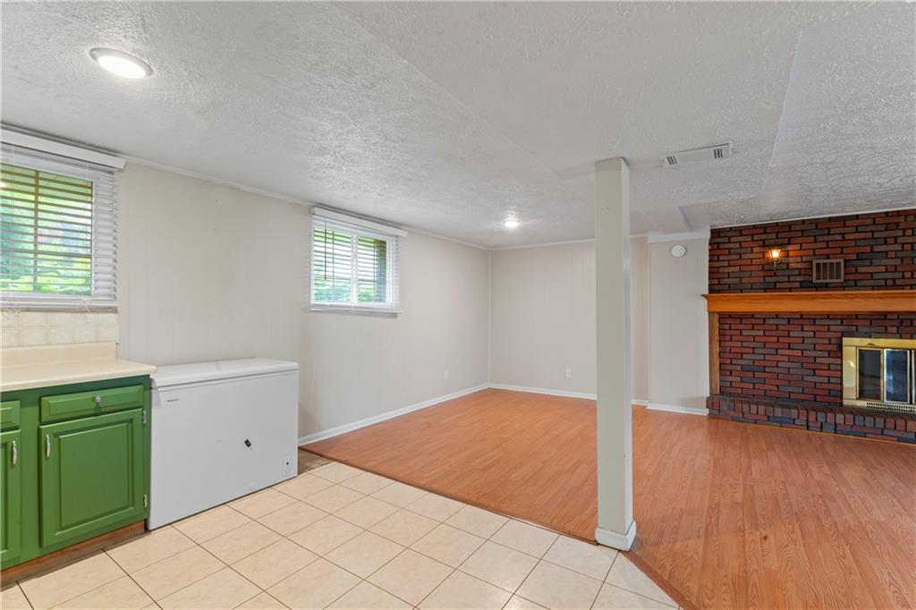 1032 Grove Street Monaca, PA 15061 - Photo 12 of 25 a view of an empty room with a window and wooden floor
