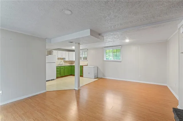 a kitchen with a refrigerator and a sink