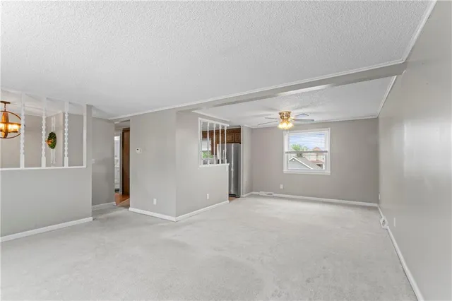 a view of an empty room with a window