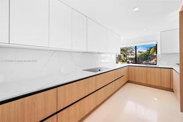 a kitchen with a sink and cabinets