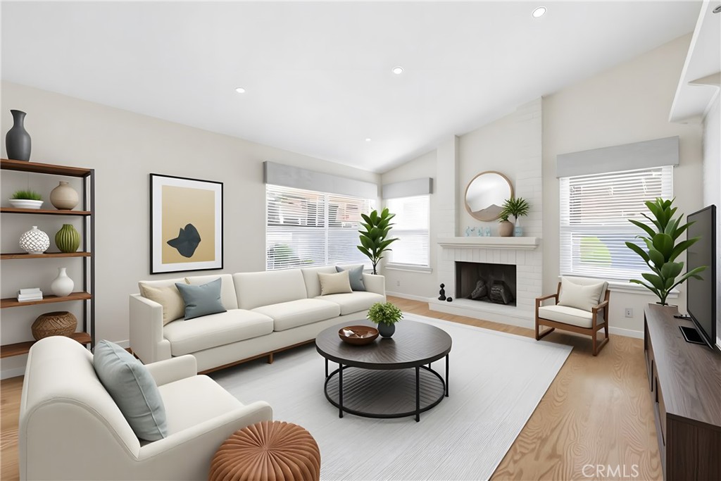 13693 Bear Valley Road Moorpark, CA 93021 - Photo 5 of 44 a living room with furniture a fireplace and a potted plant