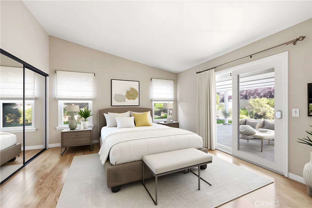 13693 Bear Valley Road Moorpark, CA 93021 - Photo 10 of 44 a bedroom with a bed and glass door