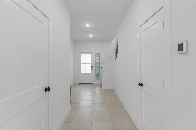 a view of kitchen with stainless steel appliances refrigerator stove microwave and cabinets