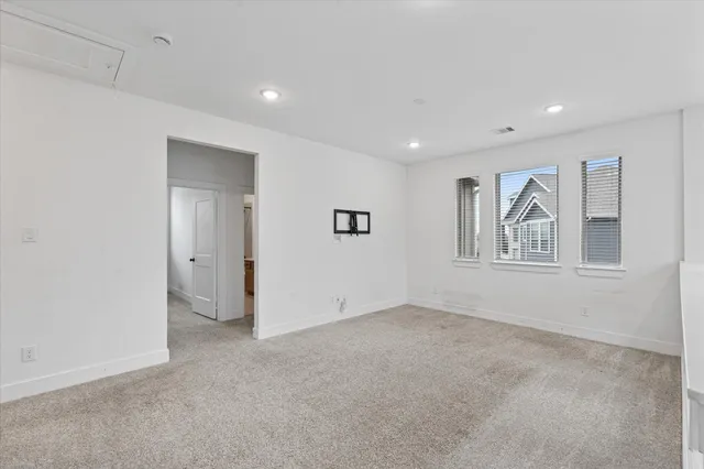 a view of a hallway with a white walls