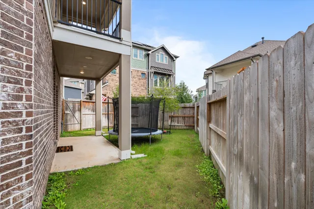 a view of a house with yard and sitting area