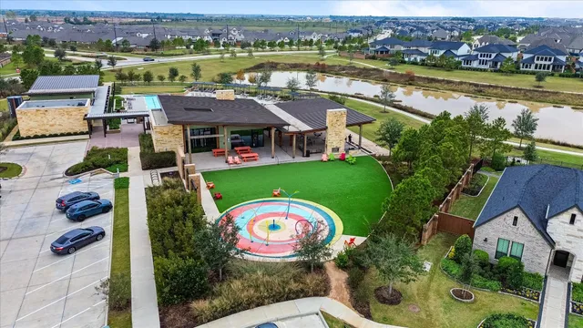 an aerial view of a house with a lake view