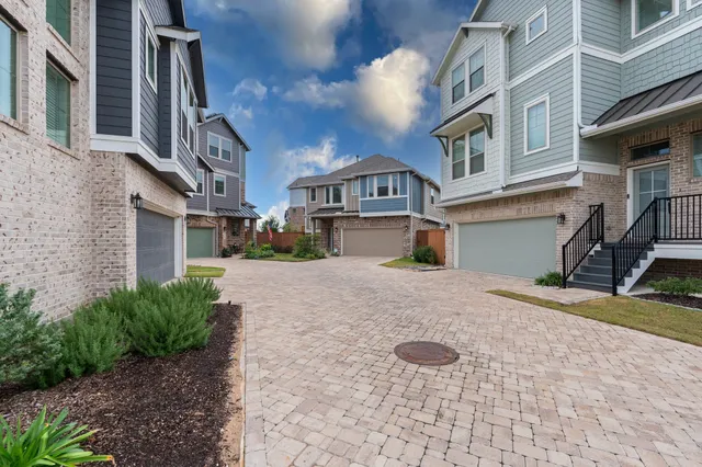 a view of a kitchen with a sink and a chandelier
