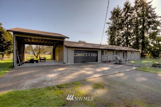 8446 178th Avenue Southwest Rochester, WA 98579 - Photo 1 of 34 a view of a house with a yard and garage