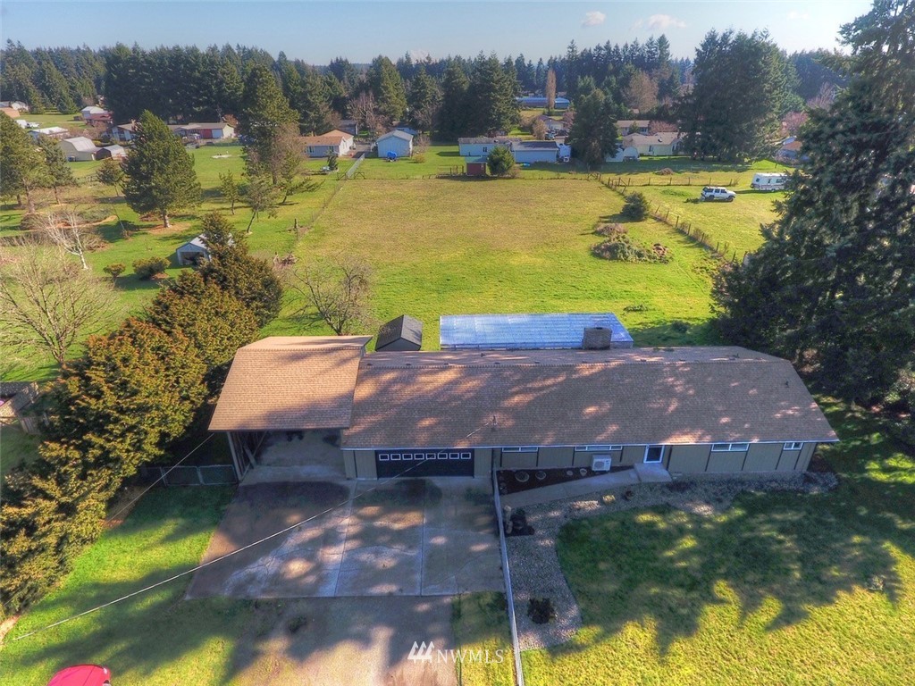 8446 178th Avenue Southwest Rochester, WA 98579 - Photo 2 of 34 a view of a swimming pool with a yard