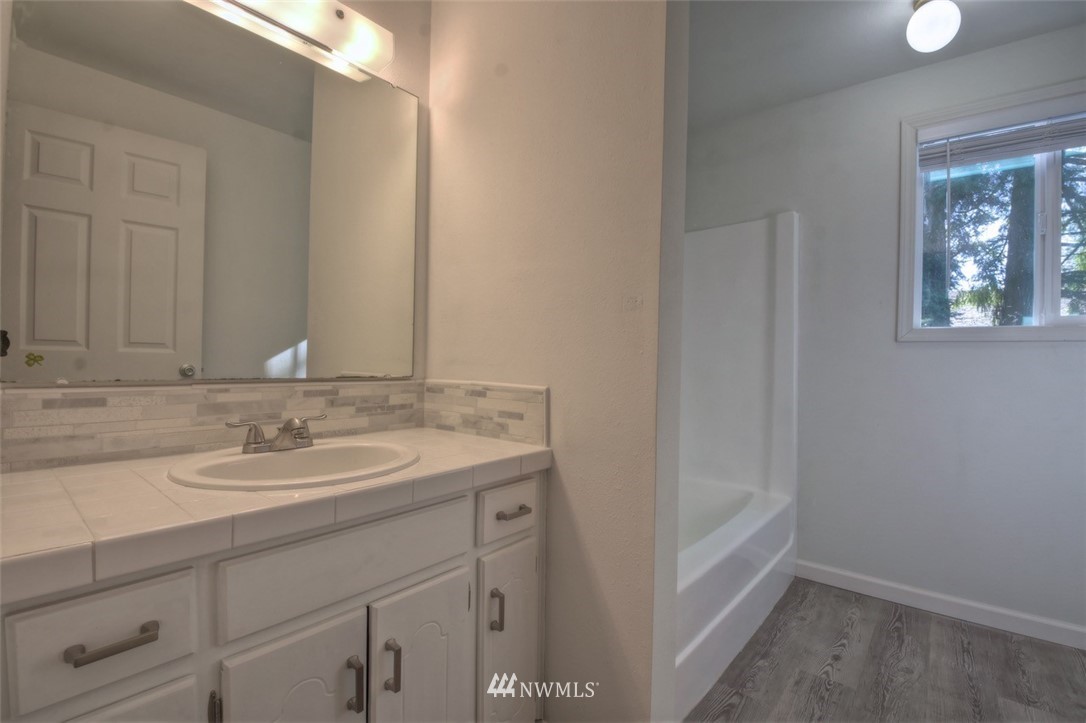 8446 178th Avenue Southwest Rochester, WA 98579 - Photo 13 of 34 a bathroom with a sink and a mirror