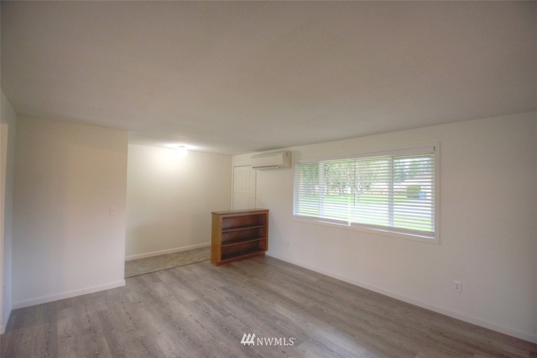 8446 178th Avenue Southwest Rochester, WA 98579 - Photo 3 of 34 an empty room with windows