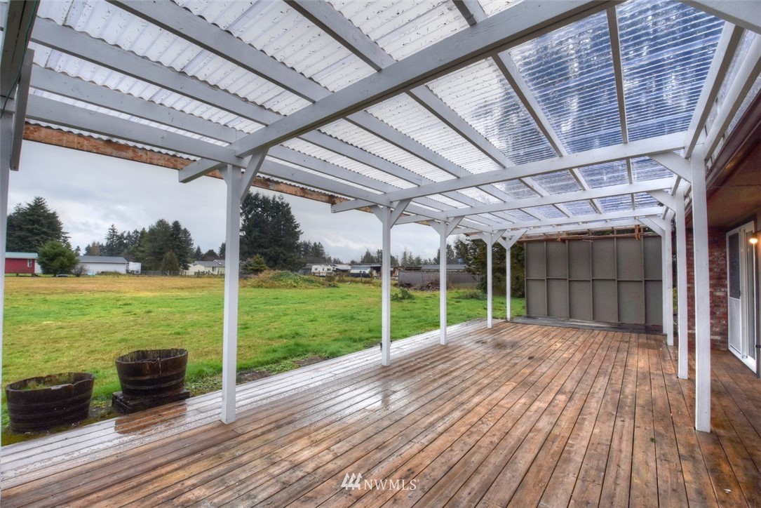 8446 178th Avenue Southwest Rochester, WA 98579 - Photo 23 of 34 a view of backyard with wooden floor and roof