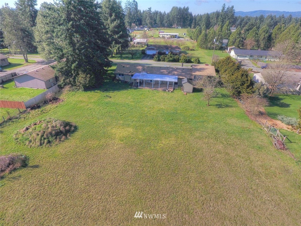 8446 178th Avenue Southwest Rochester, WA 98579 - Photo 32 of 34 a view of a house with garden space and trees