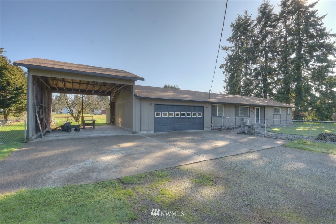 8446 178th Avenue Southwest Rochester, WA 98579 - Photo 34 of 34 a view of a house with a yard and garage