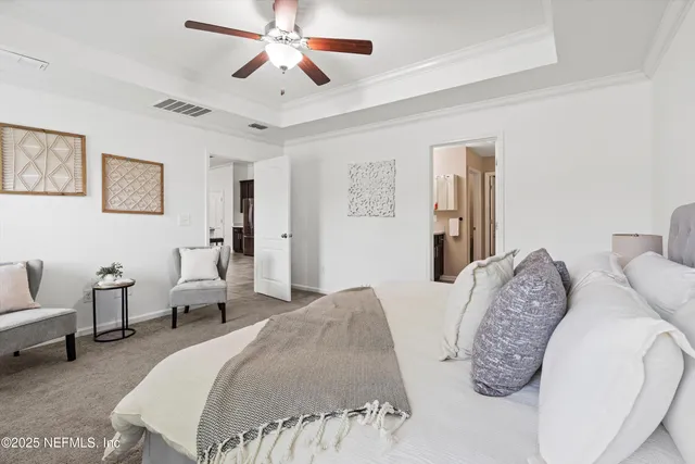 a spacious bedroom with two beds and a couch