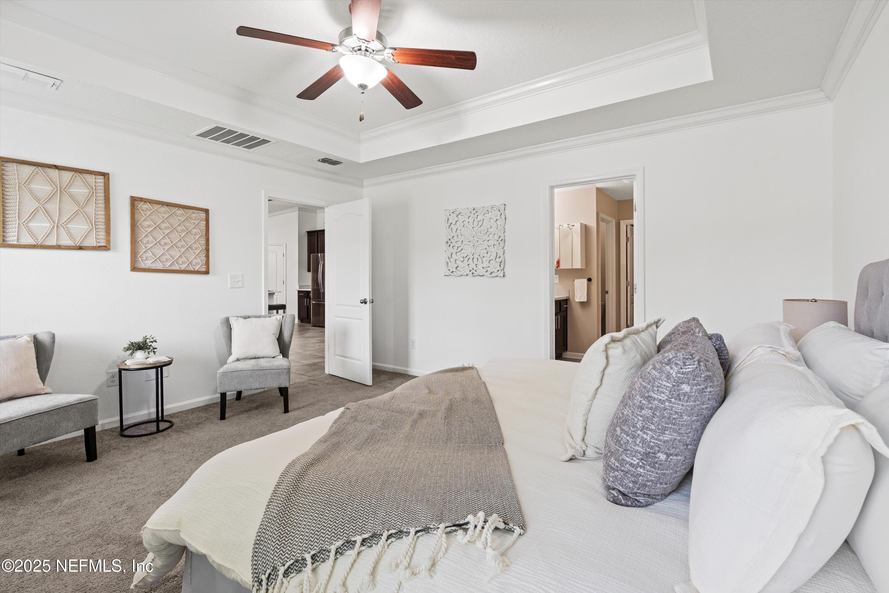 12264 Sacha Road Jacksonville, FL 32226 - Photo 12 of 32 a spacious bedroom with two beds and a couch