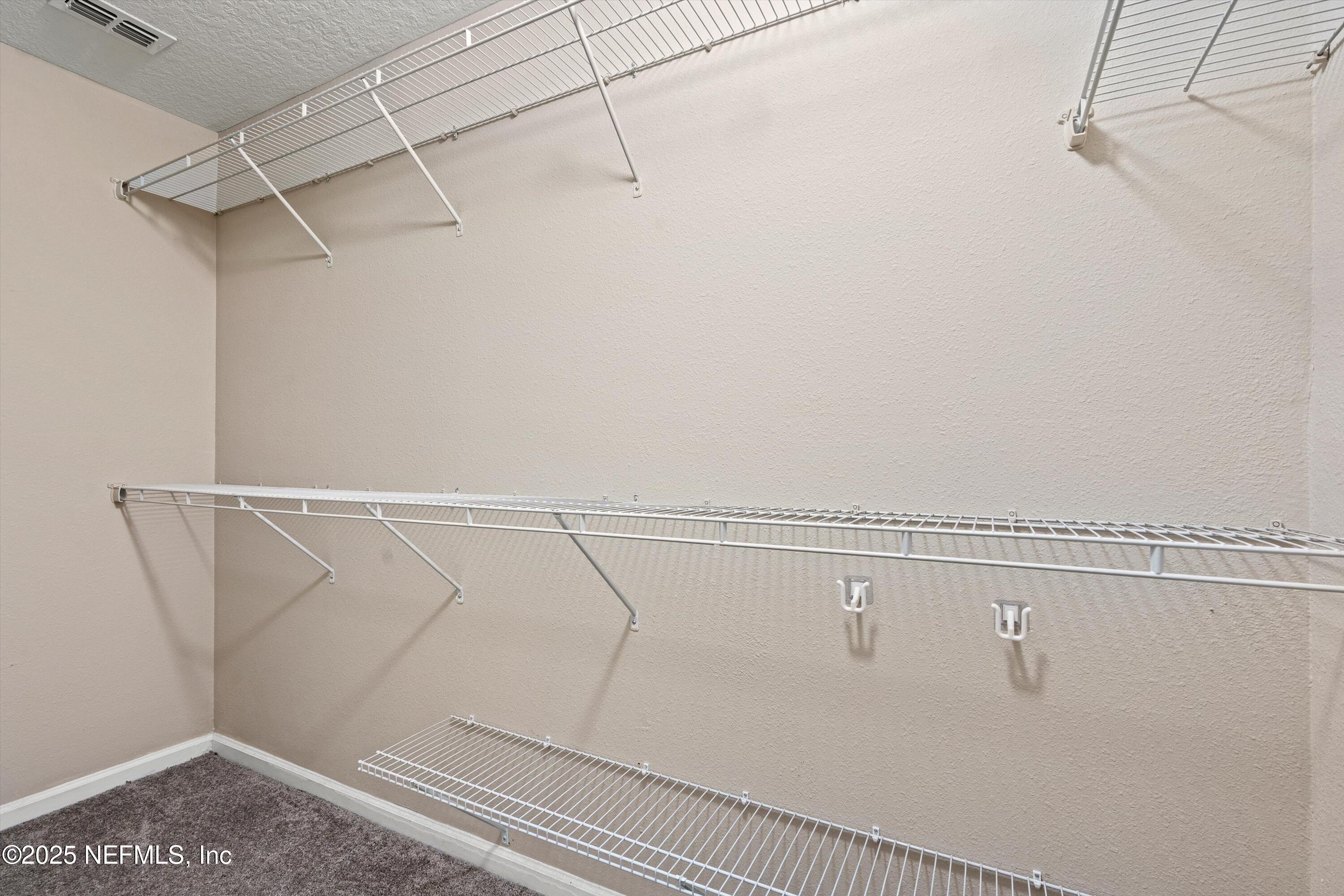 12264 Sacha Road Jacksonville, FL 32226 - Photo 15 of 32 a view of a room with racks on the wall